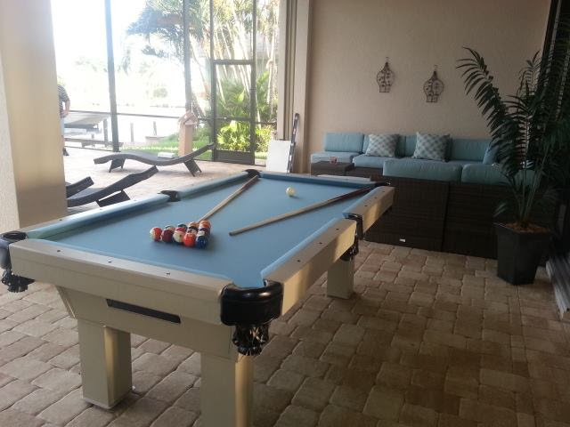 Caesar custom pool table client's outdoor living space by R&R Outdoors All Weather Billiards
