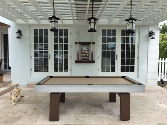 South Beach, custom outdoor pool table, is the focal point of client's outdoor living space in Florida
