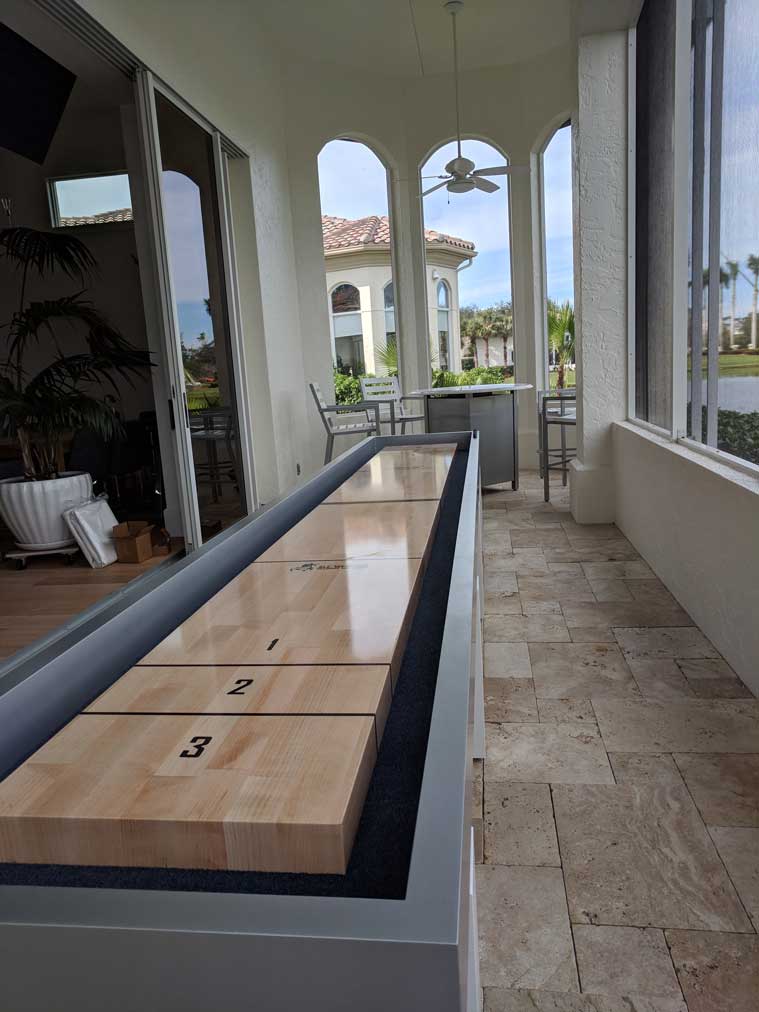 Outdoor Shuffleboard Table in Southwest Florida Home by R&R Outdoors, Inc.