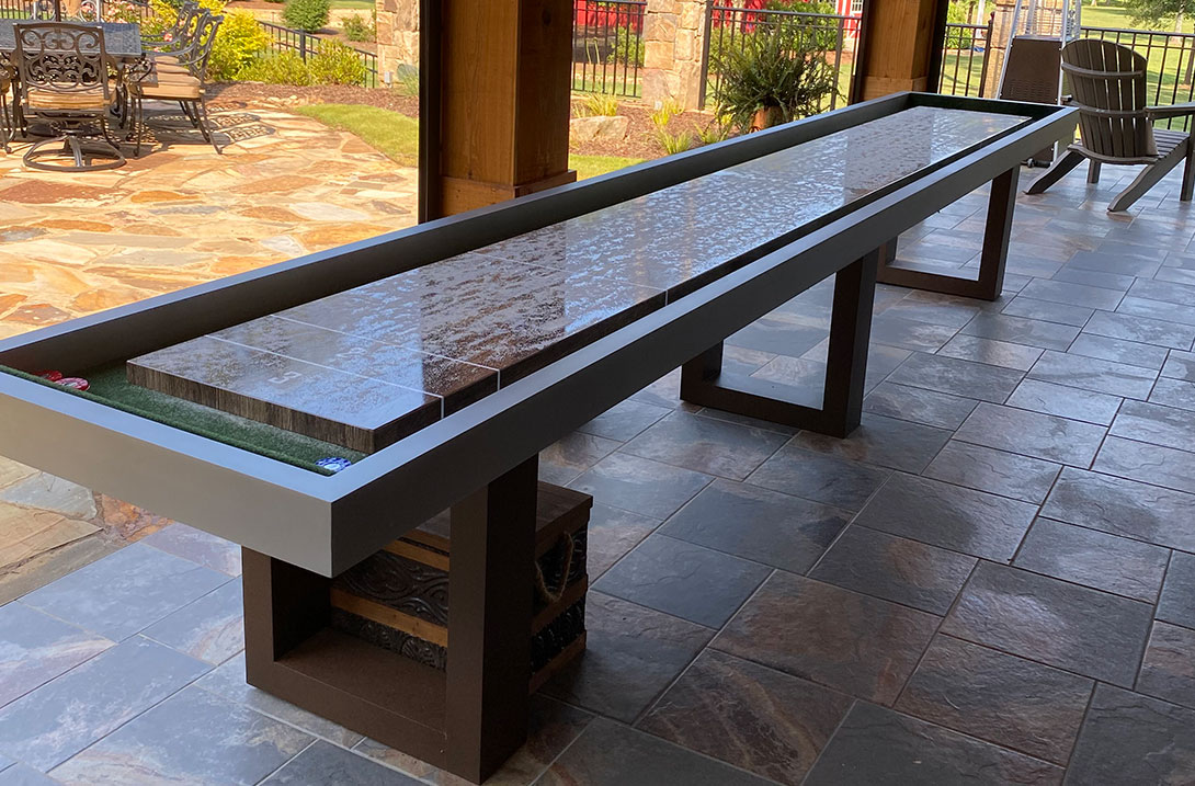 Outdoor shuffleboard table on customer's outdoor patio | R&R Outdoors All Weather Billiards