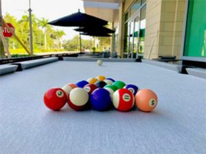Playing Pool | R & R Outdoors - Outdoor Pool Tables