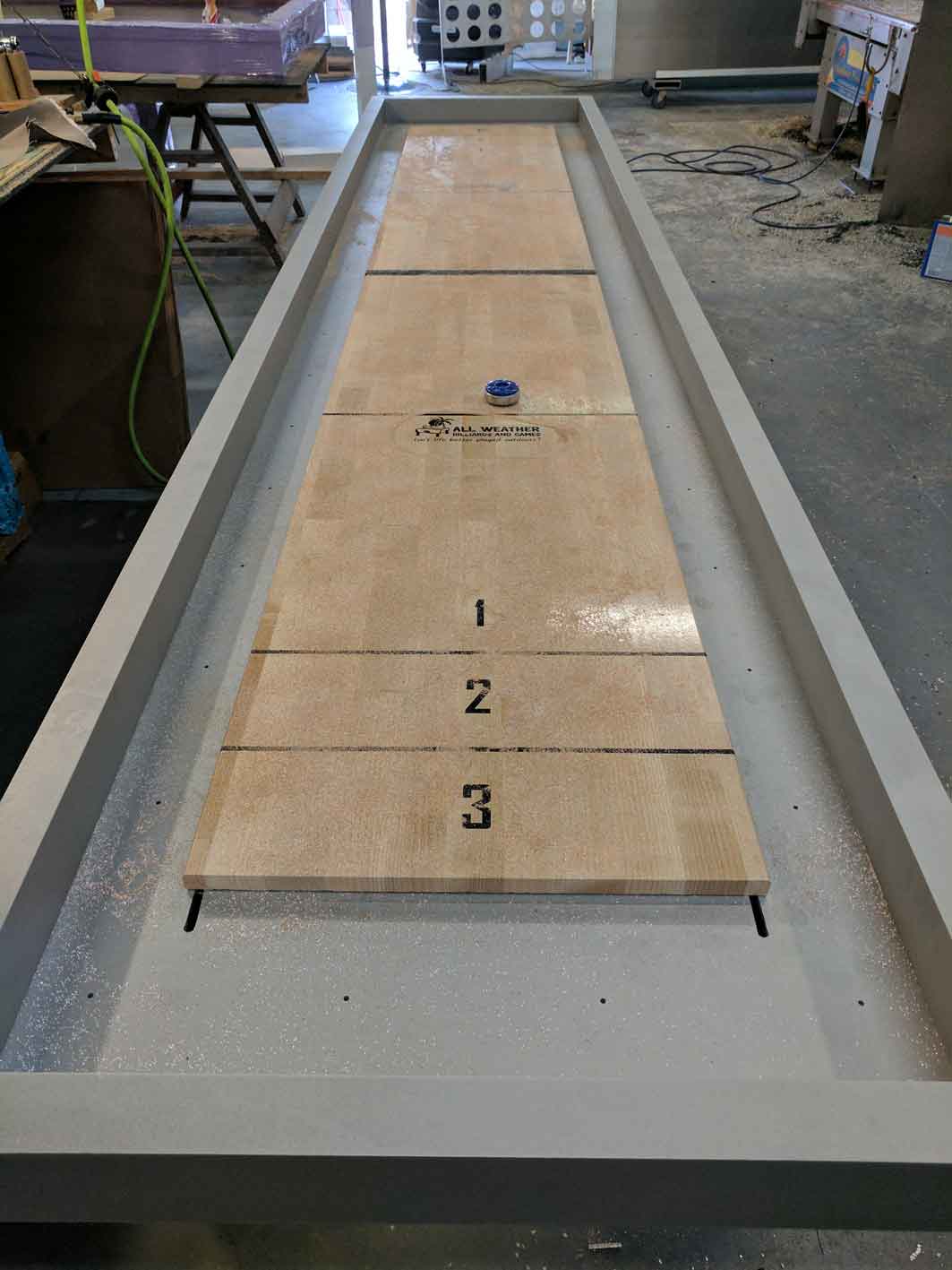Top view of custom, outdoor shuffleboard game table by R&R Outdoors All Weather Billiards
