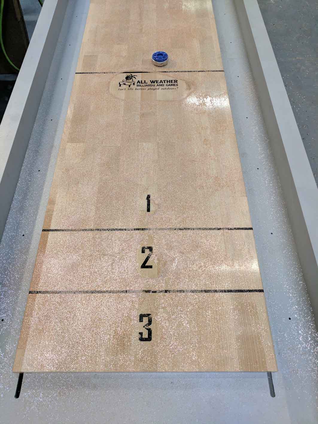 Top view of custom, outdoor shuffleboard game table by R&R Outdoors All Weather Billiards